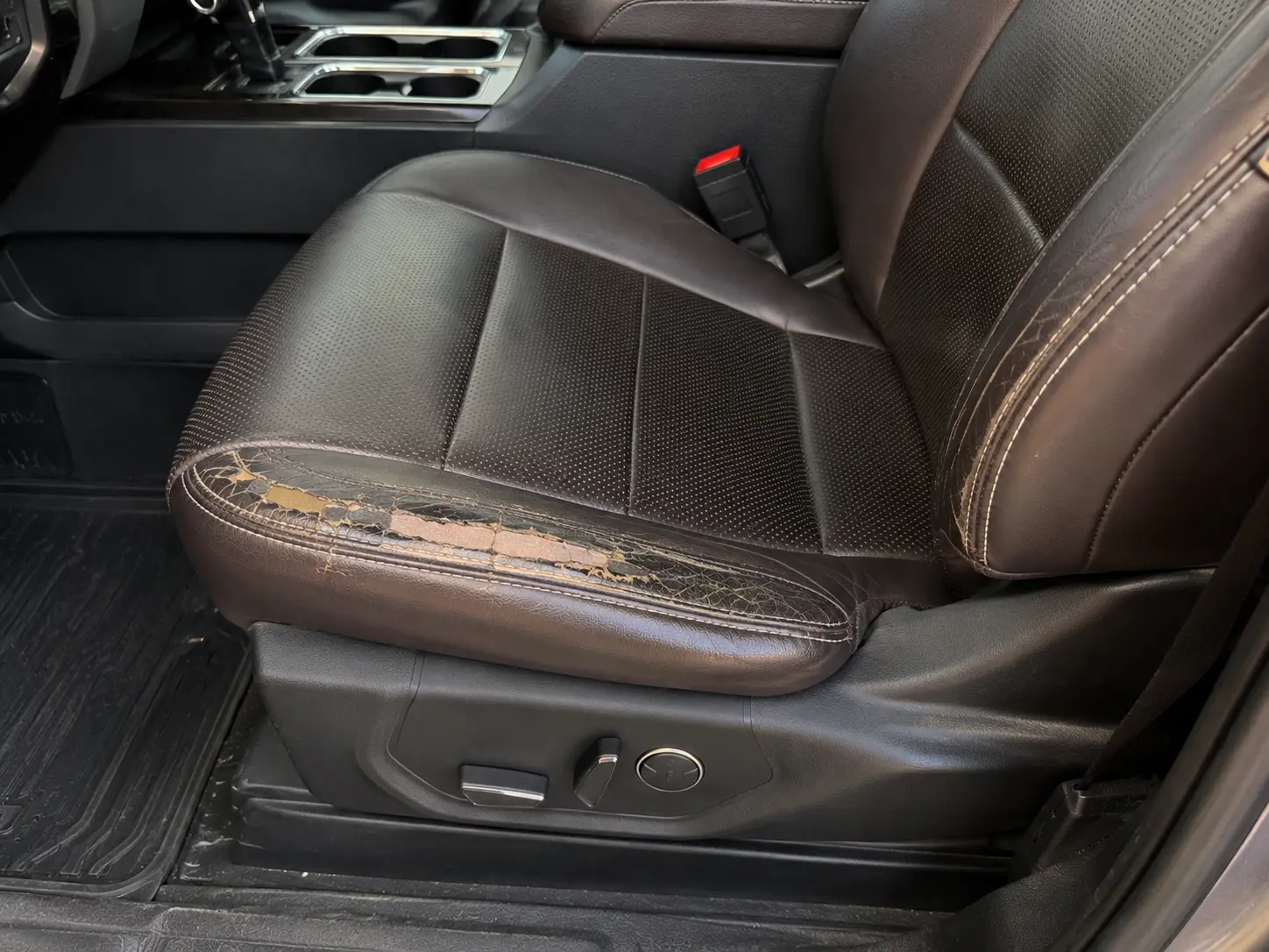 Before SUV leather seat bolster repair