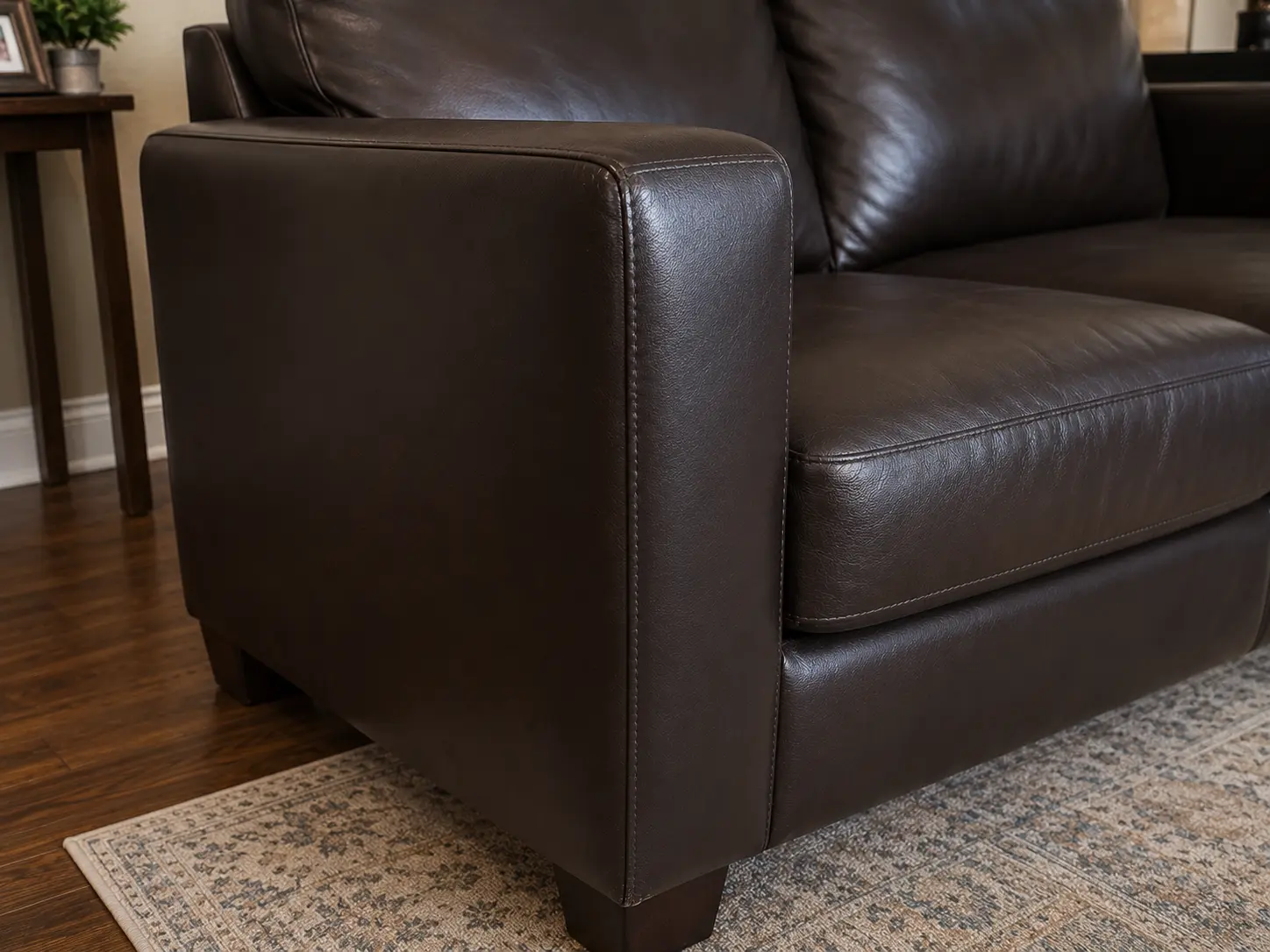 After sofa arm upholstery repair
